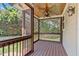 Screened porch with wood ceiling and wooden railings, showcasing outdoor views at 2712 Peachleaf St, Raleigh, NC 27614