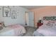 Charming bedroom featuring twin beds, playful decor, pink accent wall, and plush carpet at 272 Alice Trace Place, Angier, NC 27501