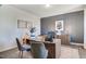 Home office featuring a large desk, comfortable seating, and stylish decor at 272 Alice Trace Place, Angier, NC 27501