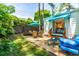 Expansive backyard with an outdoor patio, umbrella seating, and a glimpse of a serene interior space at 2725 Bedford Ave, Raleigh, NC 27607
