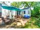 Charming backyard patio with outdoor dining set and cozy blue cushioned seating area at 2725 Bedford Ave, Raleigh, NC 27607