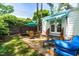 Inviting backyard patio with stone flooring, outdoor seating, and a charming white house backdrop at 2725 Bedford Ave, Raleigh, NC 27607