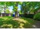 Green backyard with storage shed and fence at 2725 Bedford Ave, Raleigh, NC 27607
