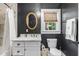 Well-lit bathroom with a toilet, window, and a marble countertop sink showcasing a blend of comfort and style at 2725 Bedford Ave, Raleigh, NC 27607