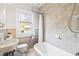 Bright bathroom featuring tile, a window, and classic fixtures, providing a clean and comfortable space at 2725 Bedford Ave, Raleigh, NC 27607