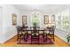 Elegant dining room with hardwood floors, chandelier, and natural light at 2725 Bedford Ave, Raleigh, NC 27607