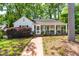 Charming house with a screened-in porch, brick walkway, and a landscaped front yard at 2725 Bedford Ave, Raleigh, NC 27607