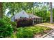Charming home with lush landscaping, a cozy front porch, and a brick walkway at 2725 Bedford Ave, Raleigh, NC 27607