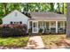 Charming home with a brick walkway and inviting screened-in porch at 2725 Bedford Ave, Raleigh, NC 27607