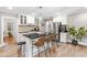 Kitchen view featuring stainless appliances, dark countertops, white cabinetry, and kitchen island seating at 2725 Bedford Ave, Raleigh, NC 27607