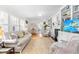 Bright living room with hardwood floors, built-in shelves, and a fireplace at 2725 Bedford Ave, Raleigh, NC 27607