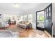 Cozy living room featuring hardwood floors and an open entranceway at 2725 Bedford Ave, Raleigh, NC 27607