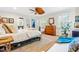 Bright main bedroom features hardwood floors, ceiling fan, and large windows with natural light at 2725 Bedford Ave, Raleigh, NC 27607