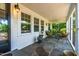 Relaxing screened porch featuring stone flooring and comfortable seating at 2725 Bedford Ave, Raleigh, NC 27607