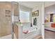 Bathroom featuring a separate shower and soaking tub, with natural light and seamless flow to main bedroom at 287 Alice Trace Place, Angier, NC 27501
