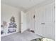 Neutral bedroom with a closet and tree art decal, creating a peaceful and calming atmosphere at 287 Alice Trace Place, Angier, NC 27501