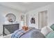 Bright bedroom featuring cool-toned walls and an airplane-themed decor with a large closet space at 287 Alice Trace Place, Angier, NC 27501
