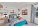Themed bedroom with a blue bed, unique wall art, and modern decor at 287 Alice Trace Place, Angier, NC 27501