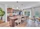 Spacious kitchen with granite countertops, stainless steel appliances, and a large island with barstool seating at 287 Alice Trace Place, Angier, NC 27501