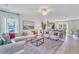 Open-concept living space with a view of the modern kitchen, creating a seamless flow for entertaining at 287 Alice Trace Place, Angier, NC 27501