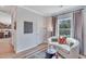 Cozy seating area with stylish decor, a patterned rug, and natural light from the window at 294 Alice Trace Place, Angier, NC 27501