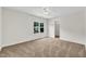 Bright bedroom with neutral walls and carpet, a ceiling fan, and a closet at 3040 Varcroft Rd, Knightdale, NC 27545
