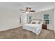 Spacious bedroom with neutral carpet, ceiling fan, and large windows for plenty of natural light at 3040 Varcroft Rd, Knightdale, NC 27545