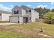 Inviting two-story home with well-maintained lawn and a two-car garage, perfect for Gathering living at 3040 Varcroft Rd, Knightdale, NC 27545