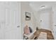 Welcoming foyer featuring a bench, neutral decor, and wood-look flooring for a modern touch at 3040 Varcroft Rd, Knightdale, NC 27545