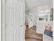 Bright hallway with wood floors, white trim, and an open view of the home's interior at 3040 Varcroft Rd, Knightdale, NC 27545
