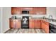 Updated kitchen featuring stainless steel appliances, granite counters, and wood cabinets at 3040 Varcroft Rd, Knightdale, NC 27545