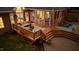 Aerial view showcasing a patio with furniture, a wooden deck, and above-ground pool at dusk at 308 Thomas Dr, Clayton, NC 27520
