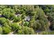 Areal view of a property surrounded by mature trees, showcasing its natural beauty at 308 Thomas Dr, Clayton, NC 27520