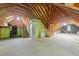 Unfinished attic space with exposed beams, insulated walls, and potential for future expansion at 308 Thomas Dr, Clayton, NC 27520