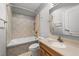 Bathroom with tile, combined tub and shower, and vanity at 308 Thomas Dr, Clayton, NC 27520