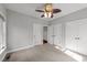 Bedroom featuring neutral walls, carpet and multiple closets at 308 Thomas Dr, Clayton, NC 27520