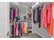 Walk-in closet with rods, shelves, and hanging clothes at 308 Thomas Dr, Clayton, NC 27520