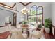 Bright formal dining area with clear table and six chairs and large windows at 308 Thomas Dr, Clayton, NC 27520