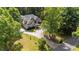 Lovely brick home with well-maintained gravel driveway and beautiful, mature landscaping at 308 Thomas Dr, Clayton, NC 27520