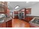 Spacious kitchen with stainless steel appliances, granite countertops and wood cabinets at 308 Thomas Dr, Clayton, NC 27520