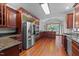 Spacious kitchen featuring stainless appliances, granite counters, and wood cabinetry at 308 Thomas Dr, Clayton, NC 27520