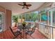 Relaxing screened-in porch with outdoor dining area overlooking the pool at 308 Thomas Dr, Clayton, NC 27520