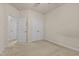 The secondary bedroom features carpeted floors, a closet, and access to the ensuite bathroom at 309 Coachman'S Trl, Stem, NC 27581
