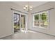 Bright dining area featuring a sliding glass door and large windows at 309 Coachman'S Trl, Stem, NC 27581