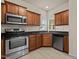 Updated kitchen with stainless steel appliances and granite countertops at 309 Coachman'S Trl, Stem, NC 27581