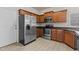 Well-equipped kitchen with stainless steel appliances and ample cabinet space at 309 Coachman'S Trl, Stem, NC 27581