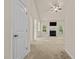 Bright living room featuring a fireplace, ceiling fan, and lots of natural light at 309 Coachman'S Trl, Stem, NC 27581