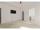 Spacious carpeted main bedroom featuring a television and en-suite bathroom at 309 Coachman'S Trl, Stem, NC 27581