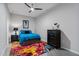 Bright bedroom featuring a colorful rug, modern ceiling fan, and stylish decor at 319 Fayetteville St, Raleigh, NC 27601