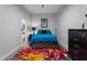 Bright, airy bedroom with ceiling fan and ensuite bathroom, bathed in natural light at 319 Fayetteville St, Raleigh, NC 27601